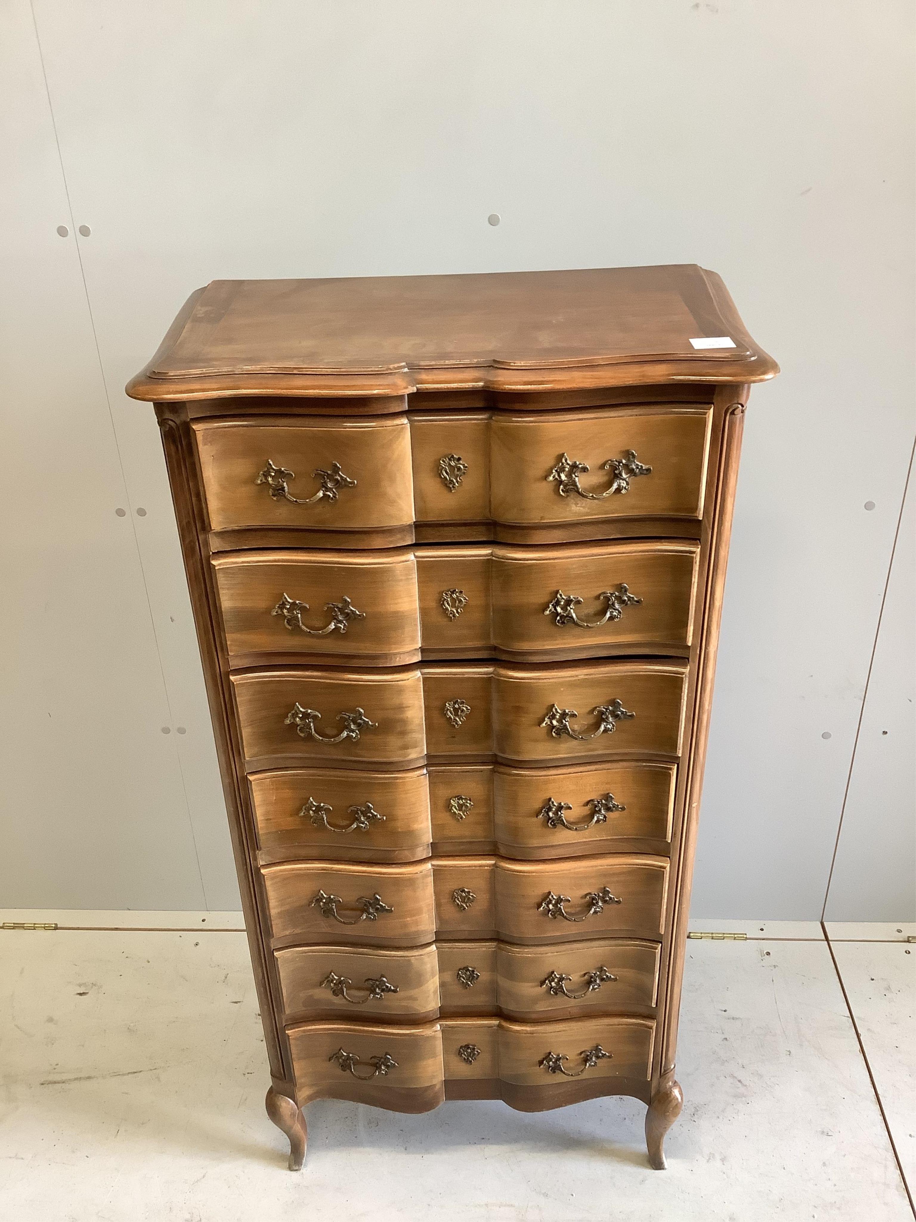 A French stained beech Semanier with seven drawers, width 66cm, height 130cm. Condition - a little faded, otherwise good